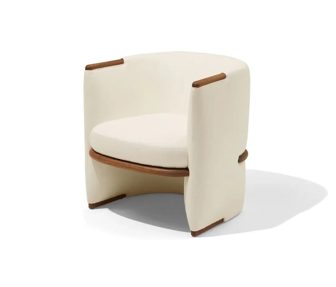 A modern upholstered barrel chair featuring a curved back and integrated arms, covered in cream-colored fabric. It has exposed dark wood elements that form a structural seat support and subtle decorative accents on the armrests and base. — 3D model