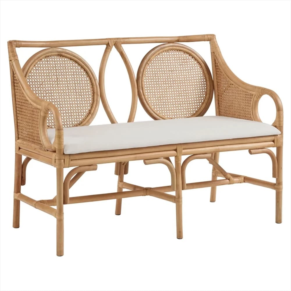 A natural rattan bench with a cane-woven back and seat, featuring decorative circular motifs on the backrest. It includes a cushioned seat pad. — 3D model