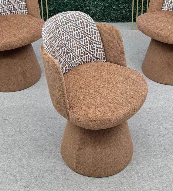 A contemporary upholstered armless accent chair featuring a plush, rounded seat and backrest. The ch… — 3D model