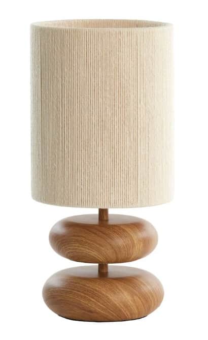 A modern table lamp featuring a stacked organic-shaped wooden base and a cylindrical shade wrapped i… — 3D model