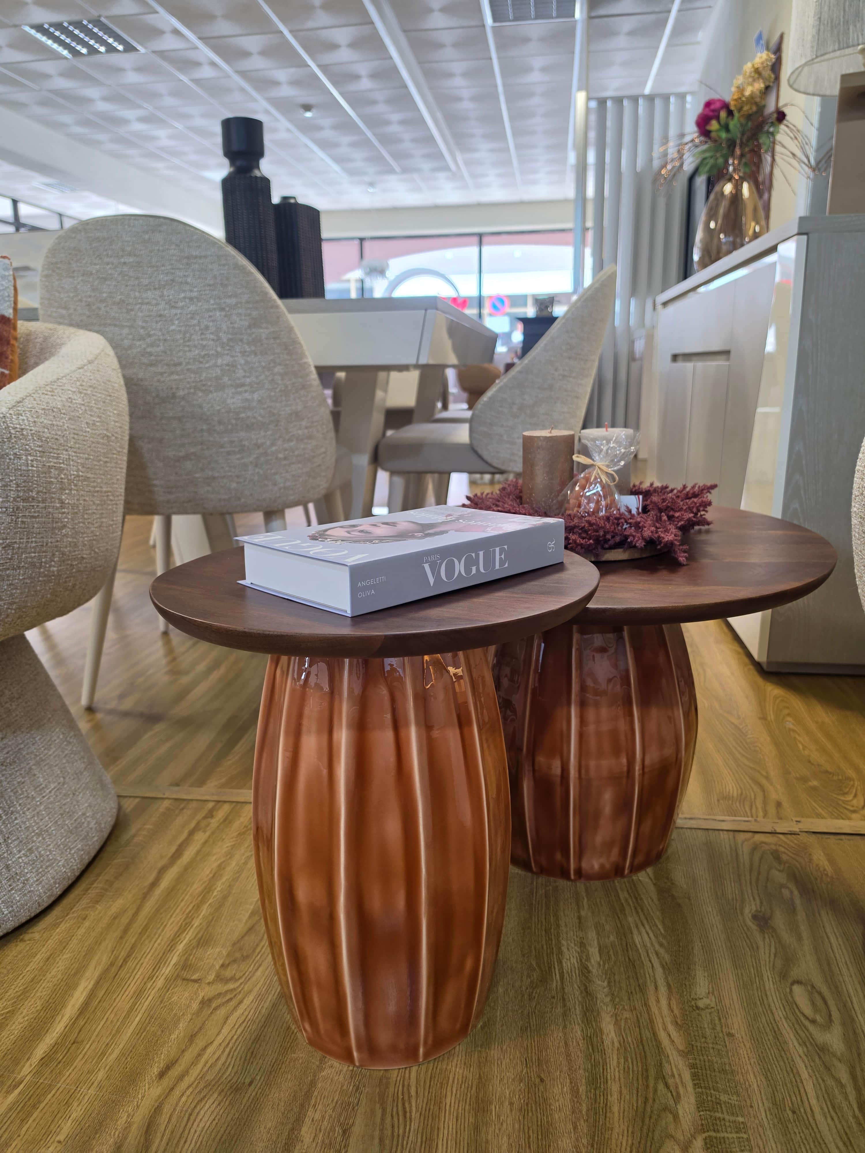 A set of two round nesting tables featuring dark wood tops and distinctive fluted, barrel-shaped cer… — 3D model