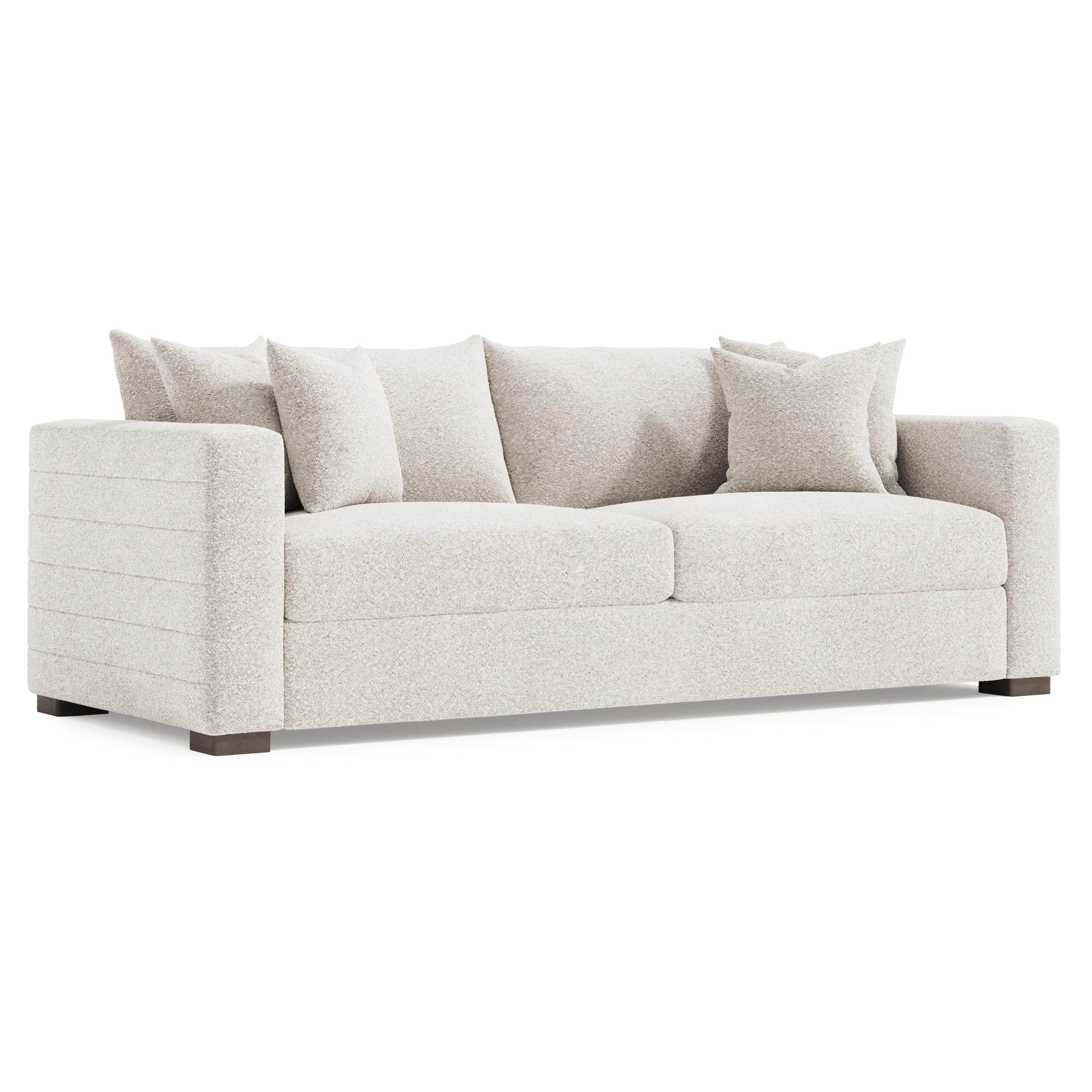 A modern, upholstered sofa with a textured, boucle-like fabric in a light neutral color. It features… — free GLTF 3D model