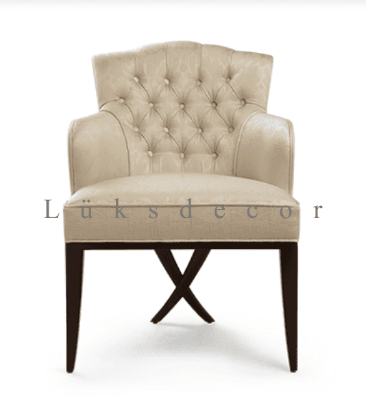 An elegant, cream-colored upholstered armchair featuring classic design elements. The chair has a ge… — free BLEND 3D model