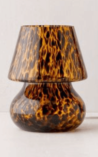A small table lamp featuring a distinctive tortoiseshell pattern across both its rounded base and co… — 3D model