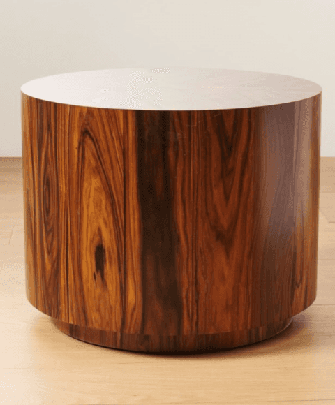 A cylindrical end table with a distinctive wood grain pattern. The table has a solid, rounded base a… — 3D model