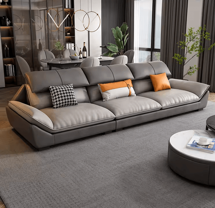 A large, modern grey leather sectional sofa featuring a low-profile design, wide integrated armrests, and individually adjustable backrests for customized comfort. The sofa is composed of multiple connected modules. — 3D model