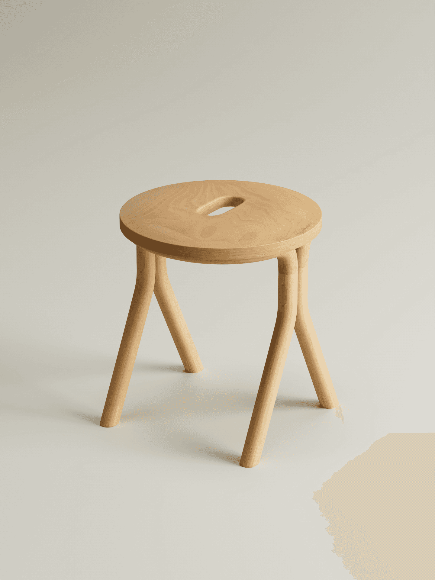 A modern stool crafted from light-toned natural wood, featuring a circular seat with an integrated elliptical handle. It is supported by three splayed legs that provide a stable base and contribute to its minimalist aesthetic. The wood has a smooth finish, highlighting its natural grain. — 3D model