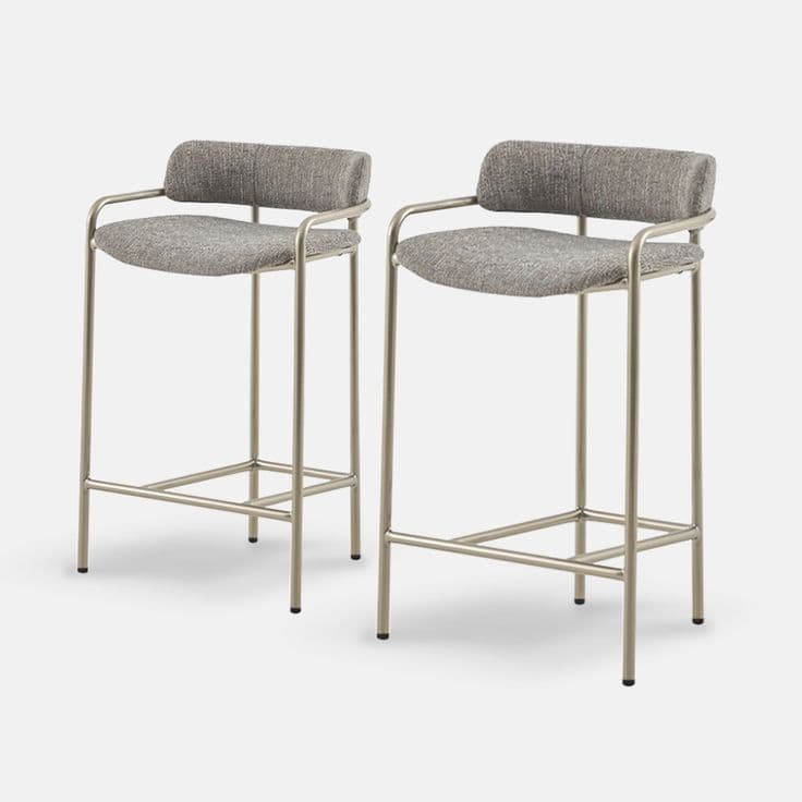 A contemporary bar stool featuring a slender tubular metal frame, upholstered seat, and a curved backrest that seamlessly extends into armrests. The stool includes a built-in footrest and sits on four straight legs. — 3D model