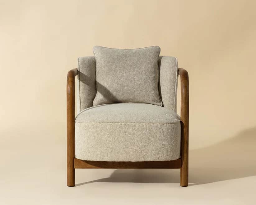 A single armchair with a wooden frame and upholstered seat, back, and armrests. It features a square… — free BLEND 3D model