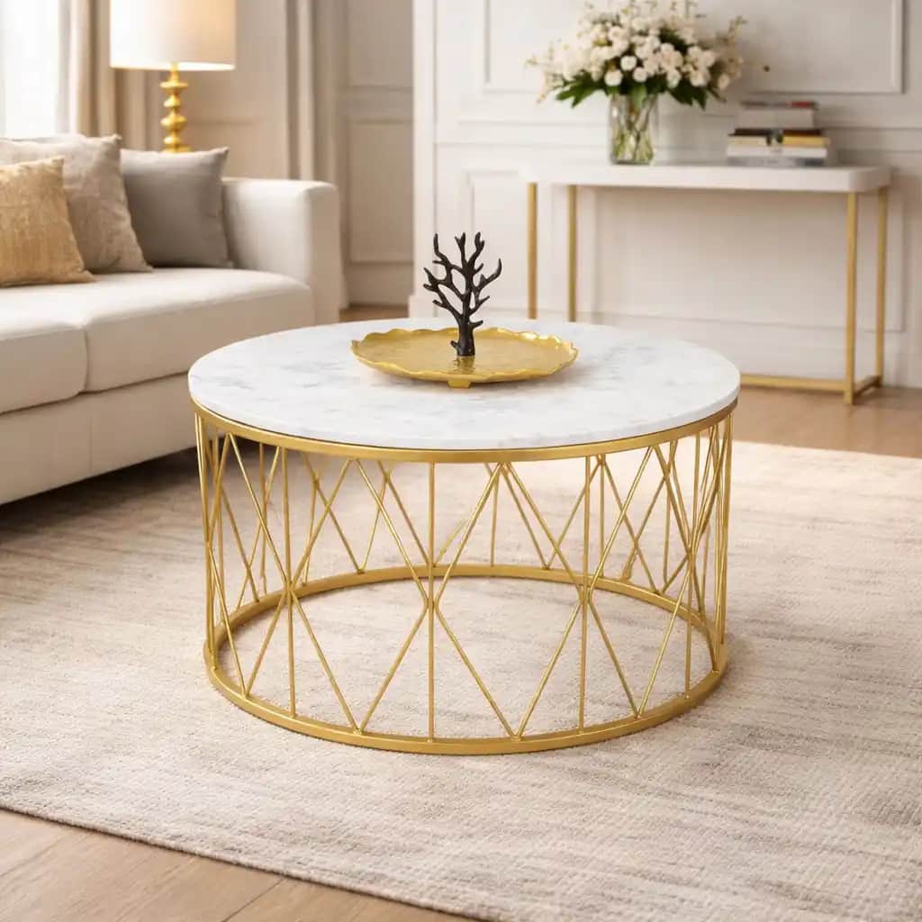 A contemporary round coffee table featuring a polished white marble top and a metallic gold-finished… — 3D model