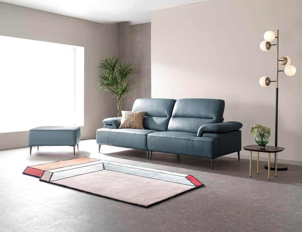 A modern sectional sofa featuring a right-hand facing chaise lounge, upholstered in a blue leather-l… — 3D model