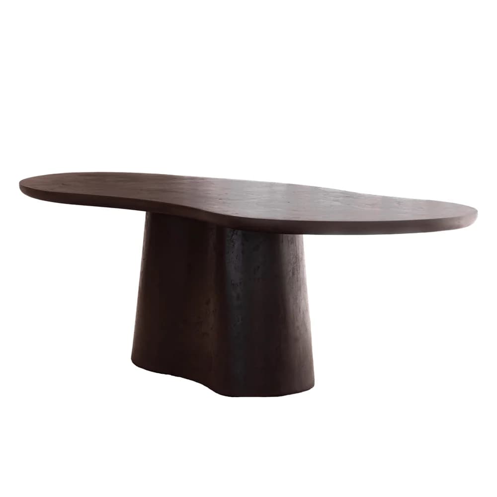 A dark, organic-shaped coffee table featuring a sculptural single pedestal base. The tabletop is irregularly oval/bean-shaped with soft, rounded edges. The base is thick and curvilinear, subtly flaring from the floor and tapering towards the top. The material appears to be dark-toned wood or wood composite with a textured, matte finish. — 3D model