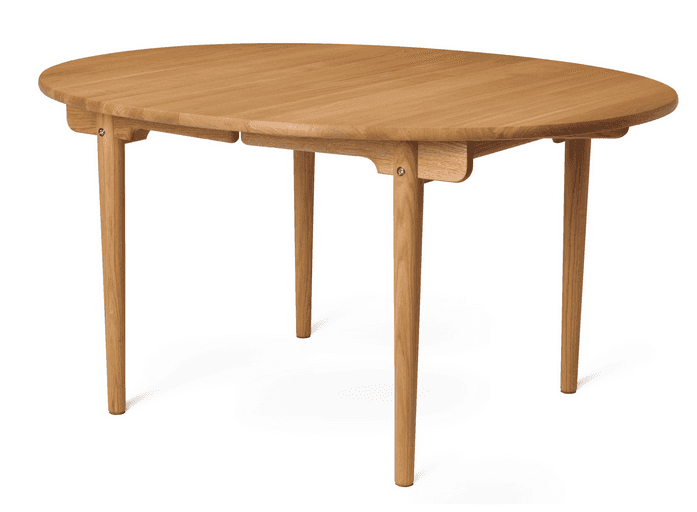 An oval wooden dining table with four tapered legs. The table surface appears to be extendable, with… — free GLB 3D model