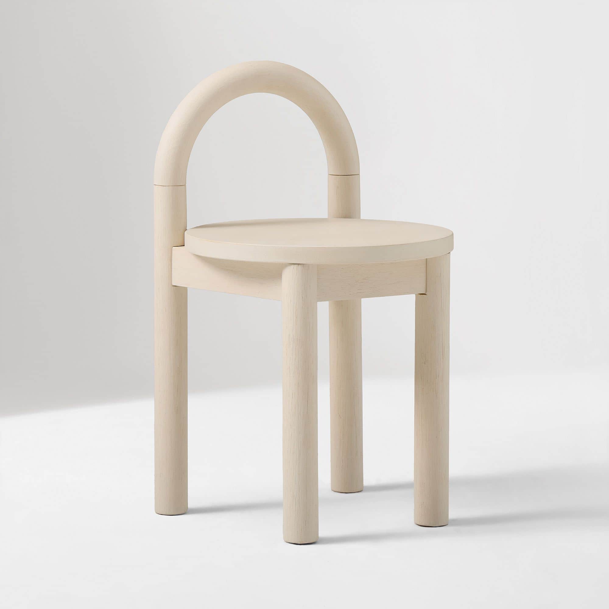 A contemporary accent chair featuring a minimalist design crafted from light-toned wood. It has a ro… — free BLEND 3D model