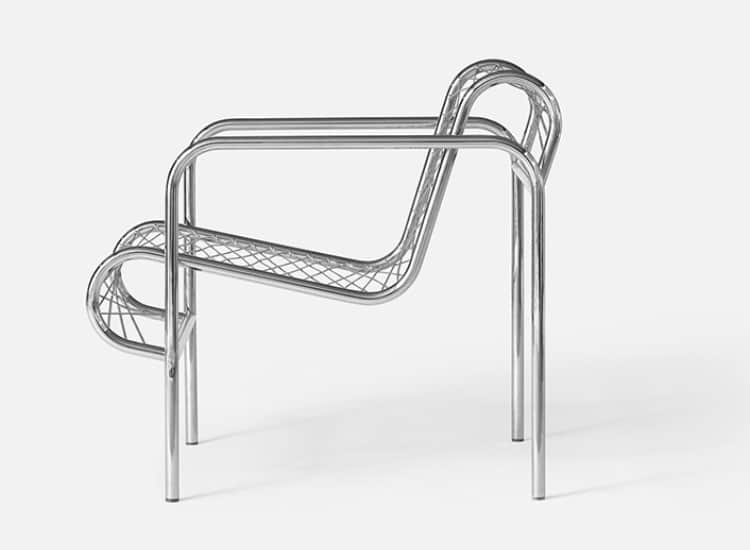 A contemporary armchair featuring a continuous frame constructed from polished tubular chrome. The s… — 3D model