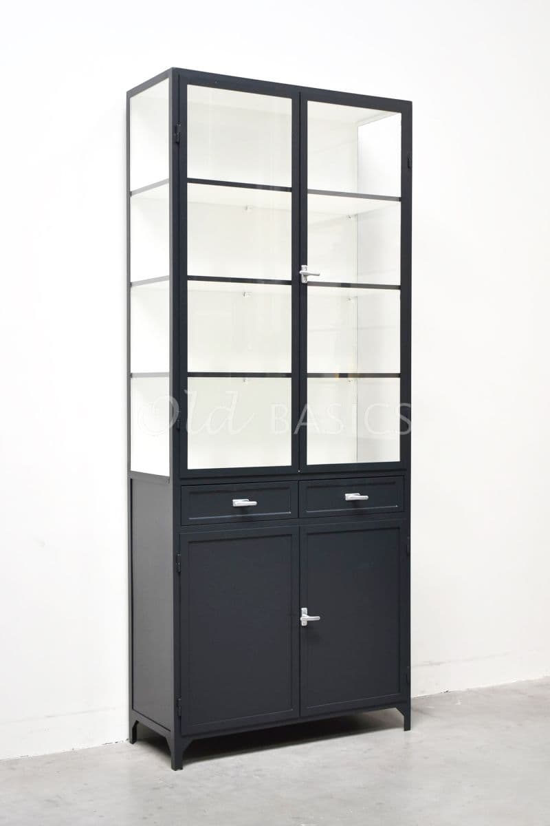 A tall, black industrial-style cabinet featuring an upper section with two frosted glass-paned doors and internal shelves, and a lower section with two small drawers and two solid, opaque doors. It is constructed from metal with a matte finish and stands on four short, angled feet. Silver-toned hardware is present on the doors and drawers. — 3D model