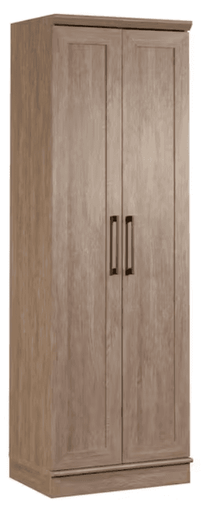 A tall, double-doored armoire with a planked wood grain finish and dark rectangular handles. The armoire features a slightly decorative top molding and a base trim. It stands on a plinth-like base. — 3D model