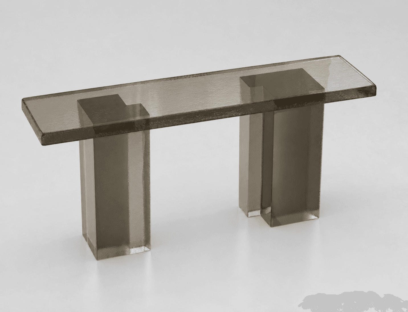A console table with a rectangular top supported by two rectangular prism legs. The table appears to be constructed from a translucent, smoked acrylic or resin material, exhibiting a textured surface. — 3D model