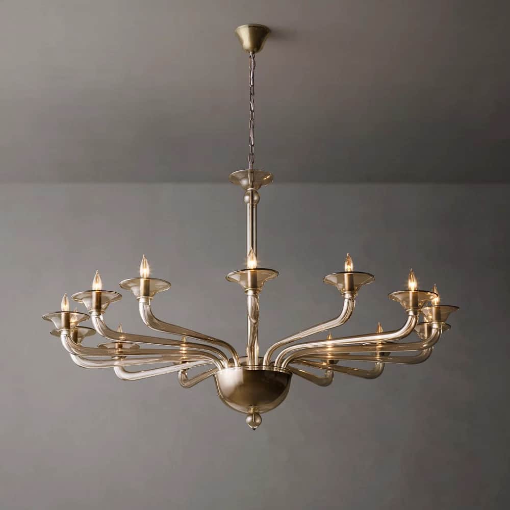 A twelve-light candelabra chandelier with a matte gold finish and clear glass or acrylic bobeches, s… — free STL 3D model