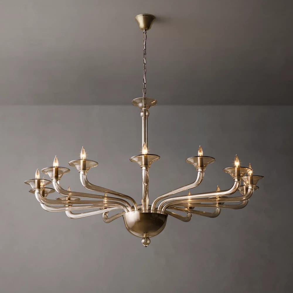 A twelve-light candelabra chandelier with a matte gold finish and clear glass or acrylic bobeches, suspended by a chain from a ceiling canopy. — 3D model