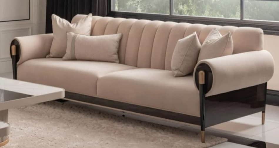 A contemporary three-seater sofa featuring a channel-tufted backrest and scrolled armrests. The sofa… — free GLTF 3D model