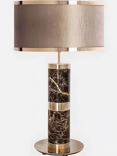 A contemporary table lamp featuring a tall, cylindrical base made of dark brown marble with prominen… — free BLEND 3D model