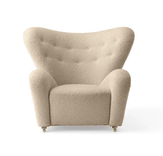 A high-backed armchair with a curved, wingback-like silhouette. The chair features a tufted backrest… — free BLEND 3D model