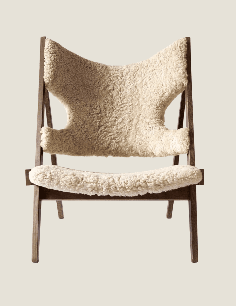 A contemporary lounge chair featuring a dark-stained wooden A-frame style base and a plush, cream-co… — 3D model