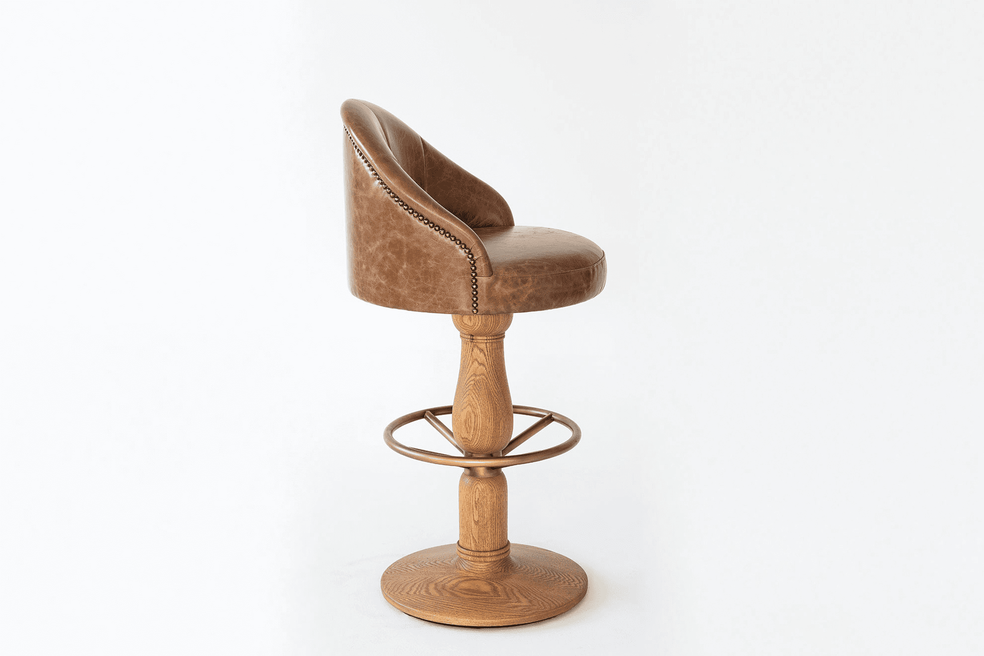 A brown, distressed leather bar stool featuring a curved, partially enclosed back with decorative na… — free SKP 3D model