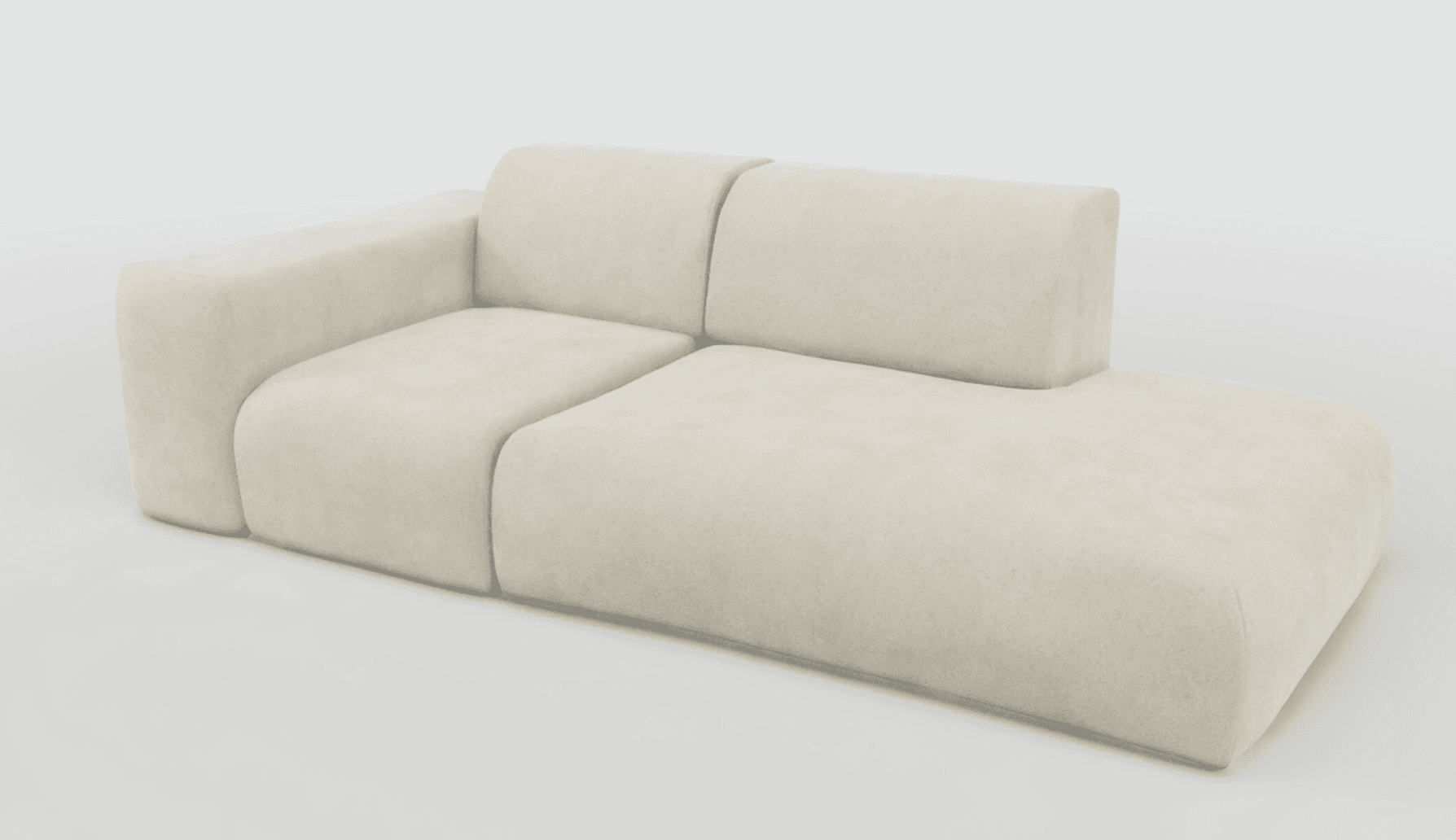 A modern, modular sofa with a low profile and rounded edges. The sofa features a sectional design with a chaise lounge extension and a distinct armrest on the left side. It is upholstered in a soft, textured fabric, likely a microsuede or velvet, and has multiple seat cushions and a single back cushion that extends across the length of the sofa. — 3D model