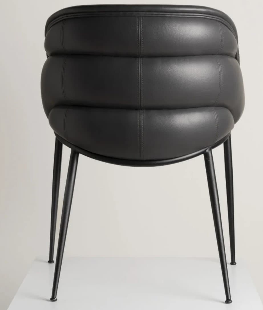 A contemporary chair with a channel-tufted upholstered back and seat, in black, supported by slender black metal legs. — 3D model