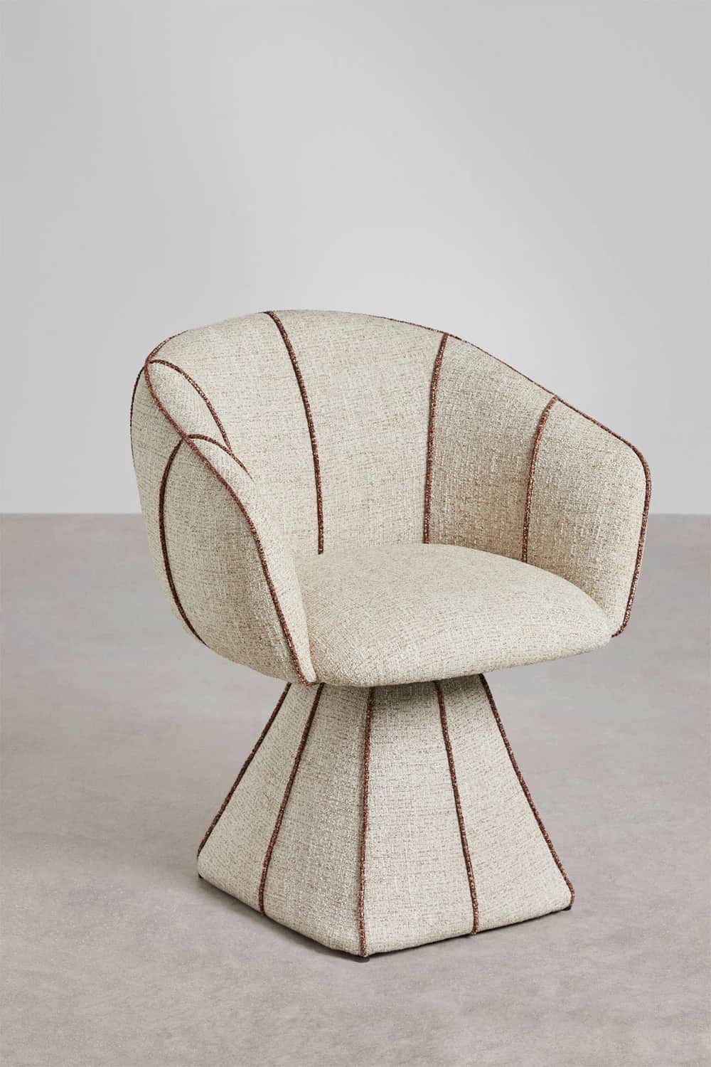 A modern accent chair with a distinctive shell-like silhouette. The chair features a swivel base and… — 3D model