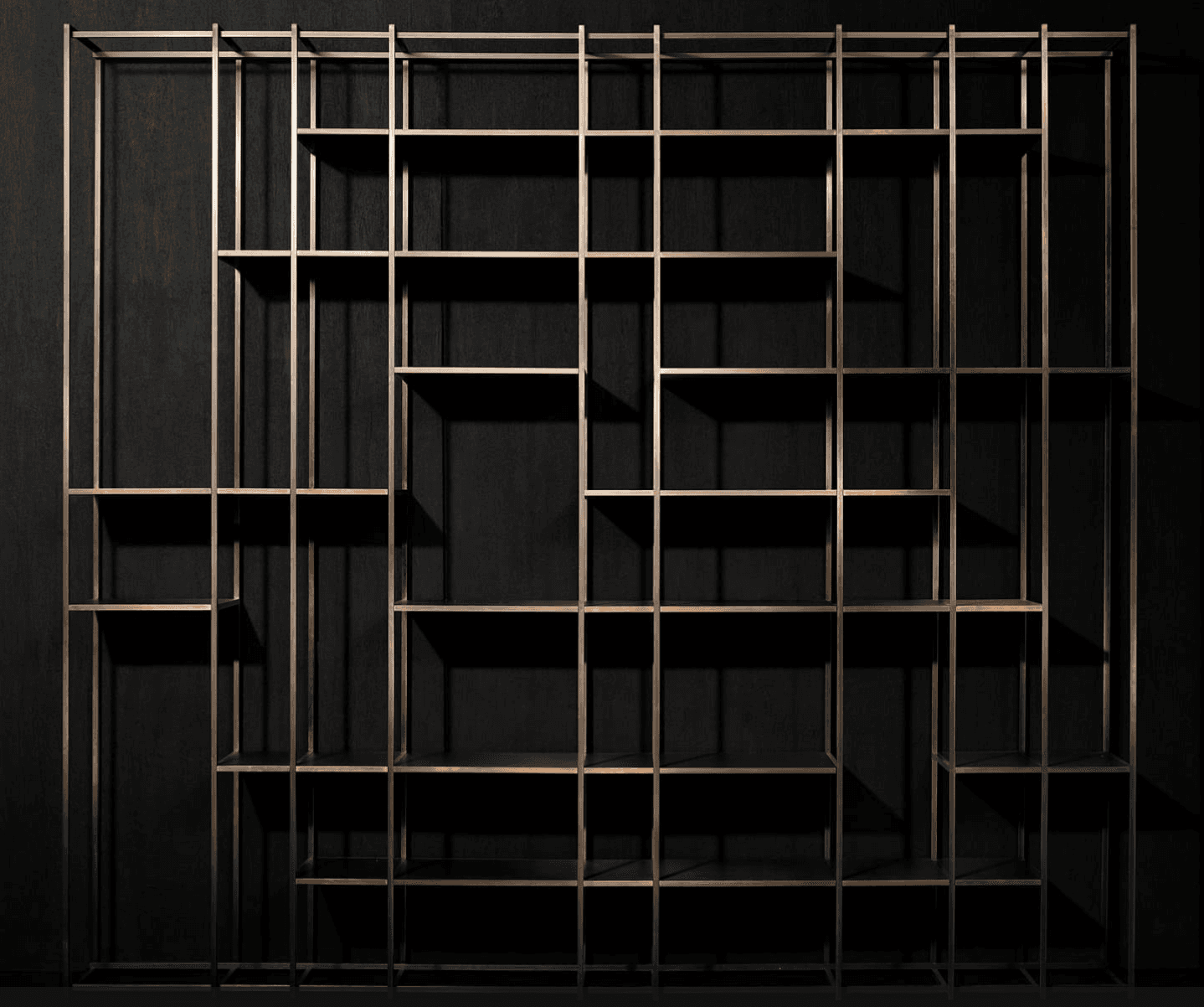 A modern, open-frame shelving unit crafted from bronzed metal, featuring a geometric arrangement of… — 3D model