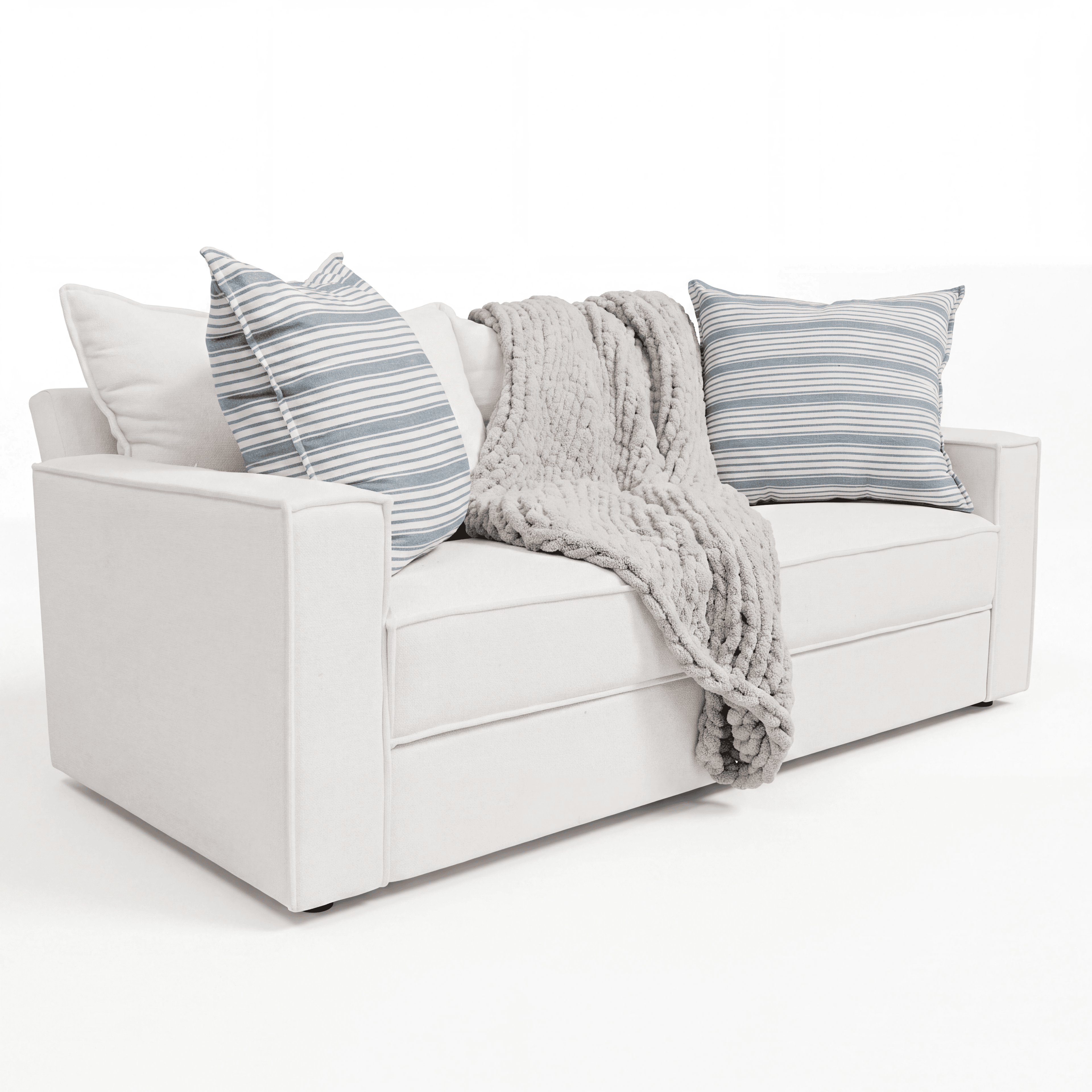 A contemporary two-seater sofa upholstered in a white fabric, featuring square track arms and adorned with striped accent pillows and a chunky knit throw. — 3D model