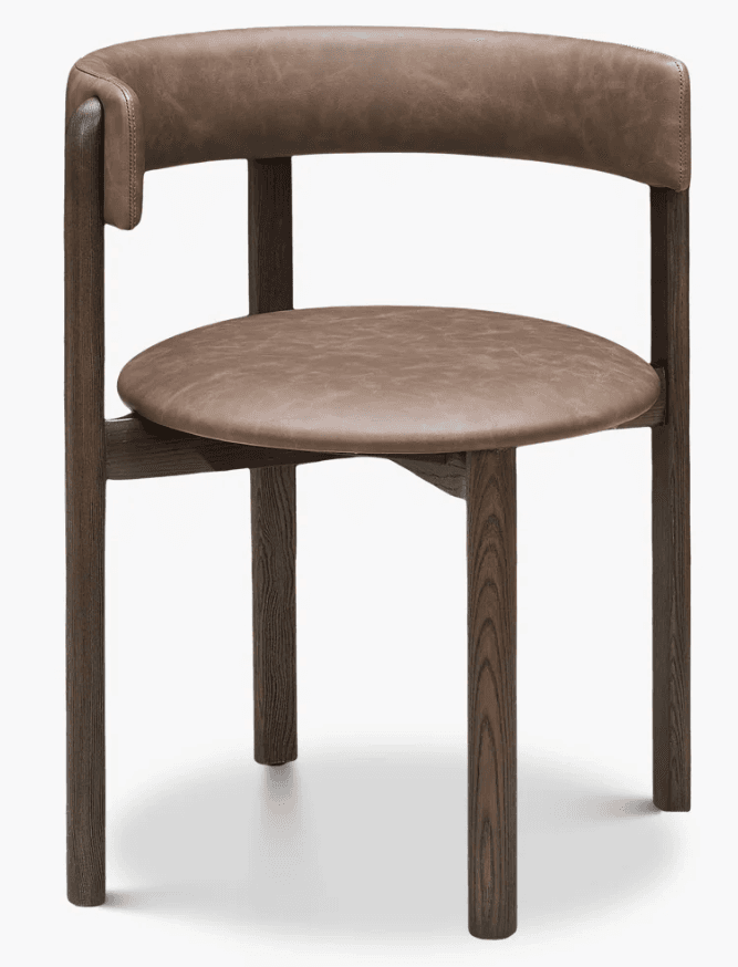 A contemporary armchair featuring a dark-stained solid wood frame and a curved backrest and round seat upholstered in brown leather. — 3D model