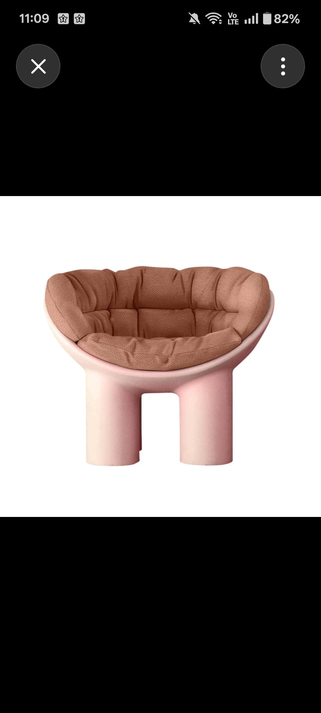 A modern, low-profile lounge chair featuring a pale pink molded shell base and a deeply tufted, terr… — free STL 3D model