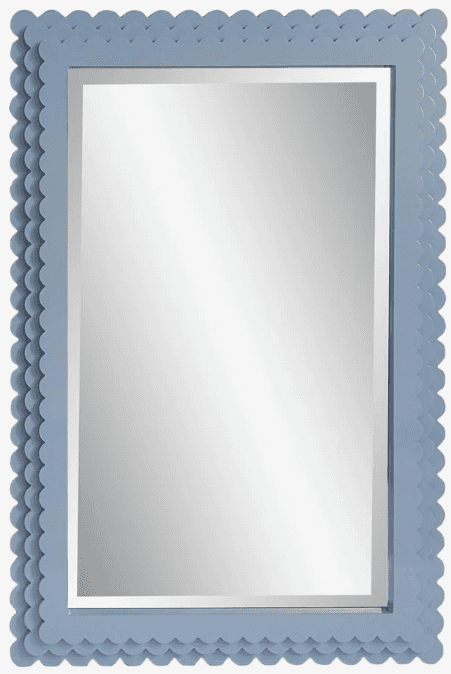 A rectangular wall mirror featuring a thick, light blue frame with a distinctive scalloped or bobble… — 3D model