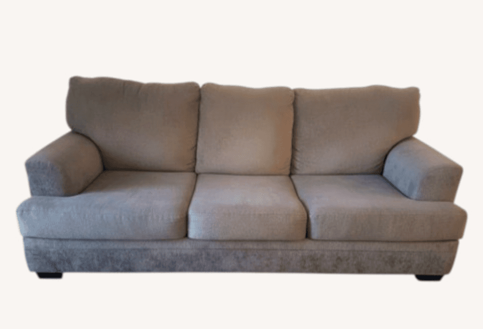 A three-cushion sofa with upholstered arms and a fabric exterior. It has a low profile with a straig… — 3D model