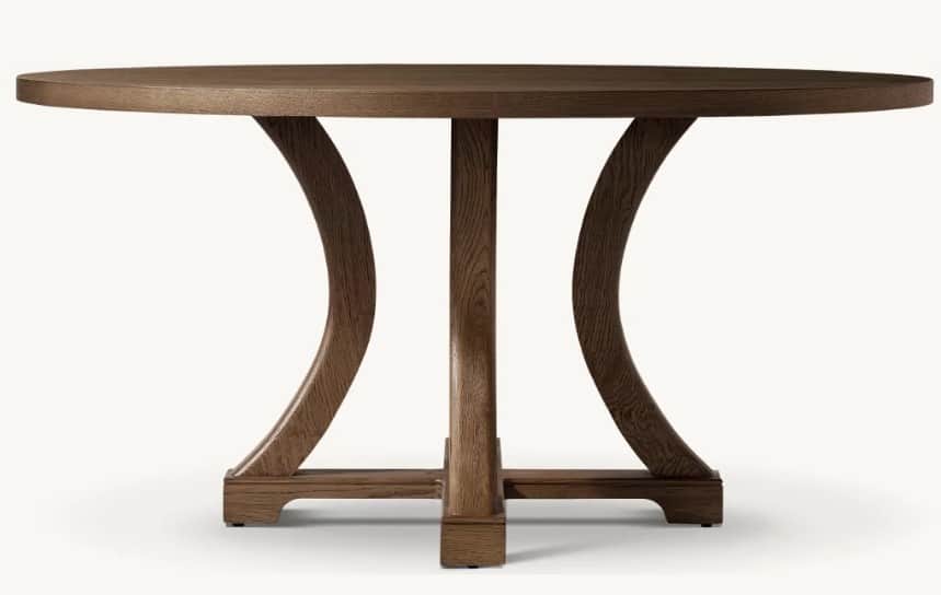A round wooden table with a distinctive pedestal base featuring four central support columns that br… — 3D model