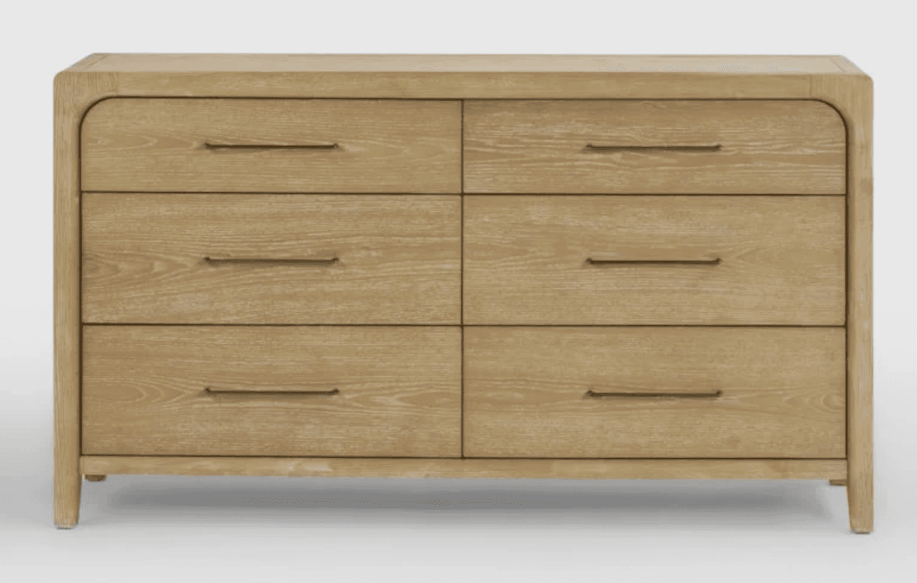 A rectangular six-drawer dresser made from light-toned oak wood with prominent grain. It features so… — 3D model