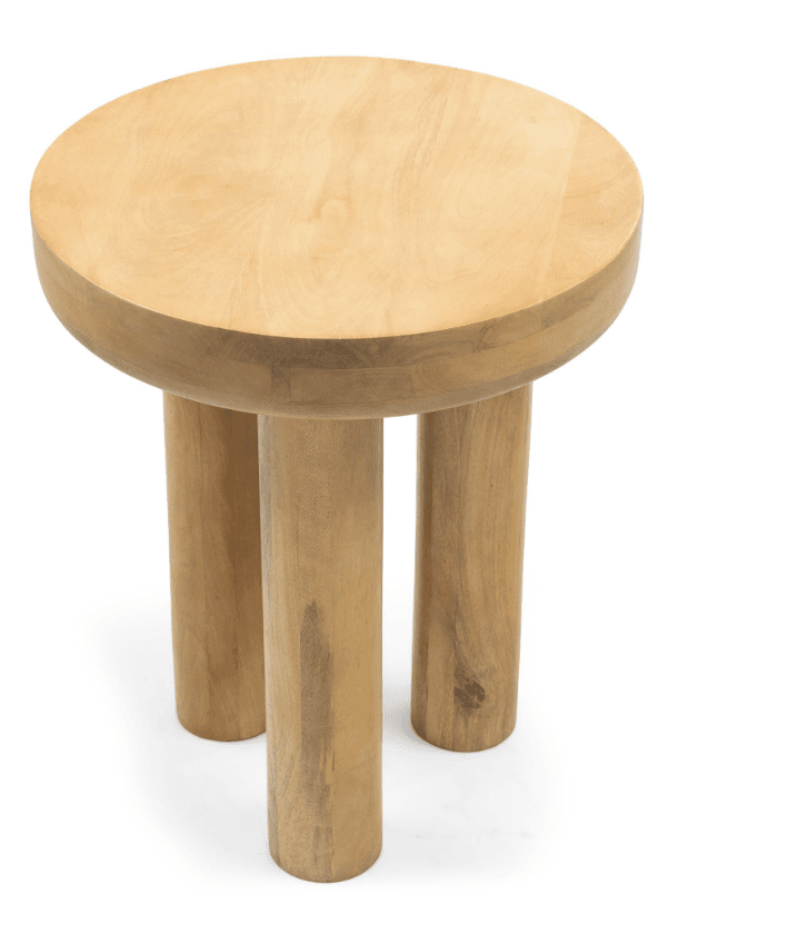 A light-colored, solid wood stool featuring a thick, circular seat and three robust, cylindrical legs. The wood displays a natural grain, and the design is minimalist and organic. — 3D model