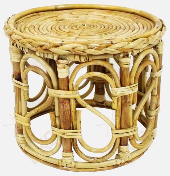 A round, intricately woven rattan accent table featuring a flat top and a decorative, openwork cylindrical base, showcasing natural light brown tones. — 3D model