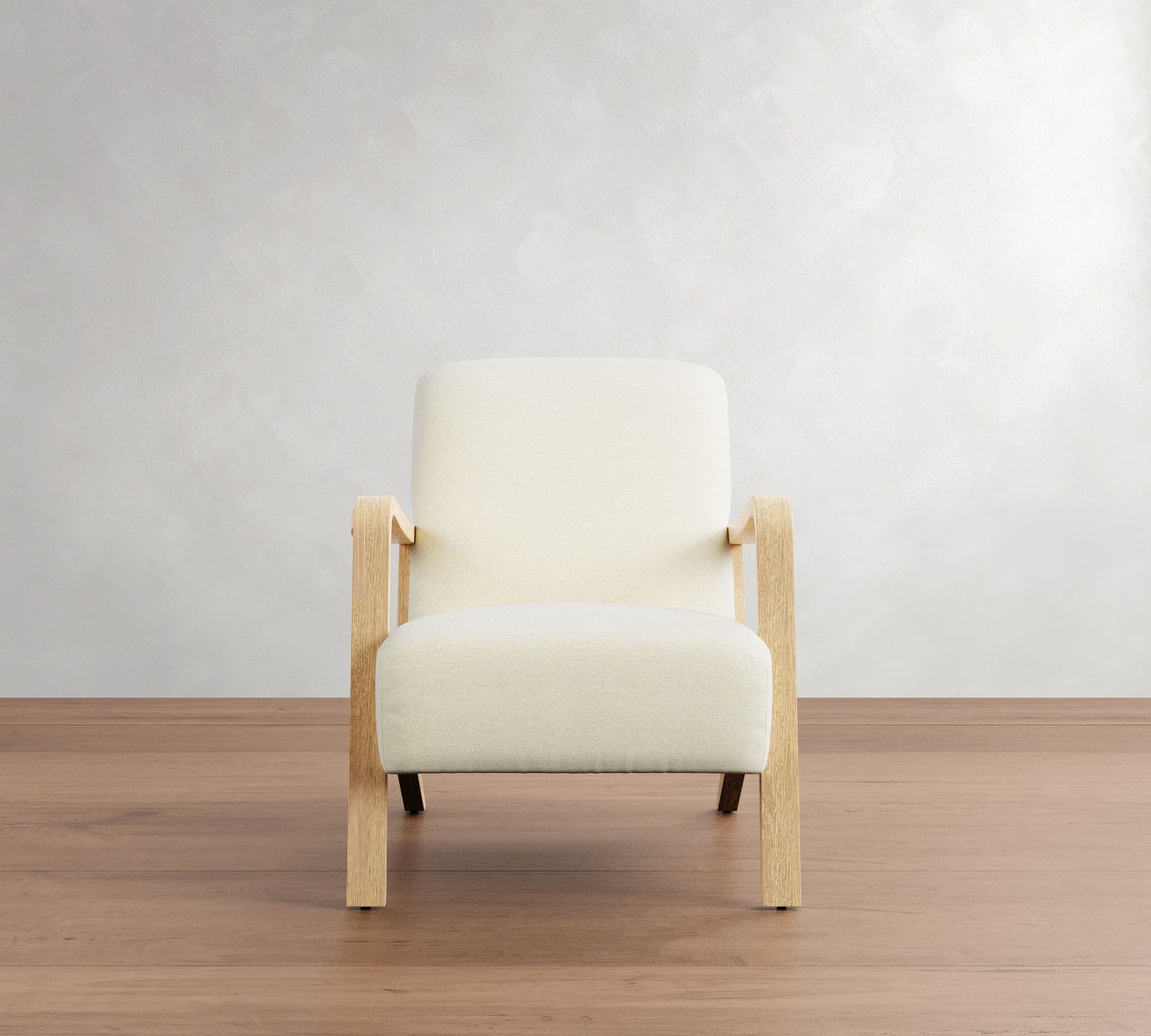 A modern armchair with a light-colored upholstered seat, back, and armrests, supported by a light wood frame. The frame consists of four legs, with the front legs extending upwards to form the armrests, and a connecting horizontal piece. — 3D model
