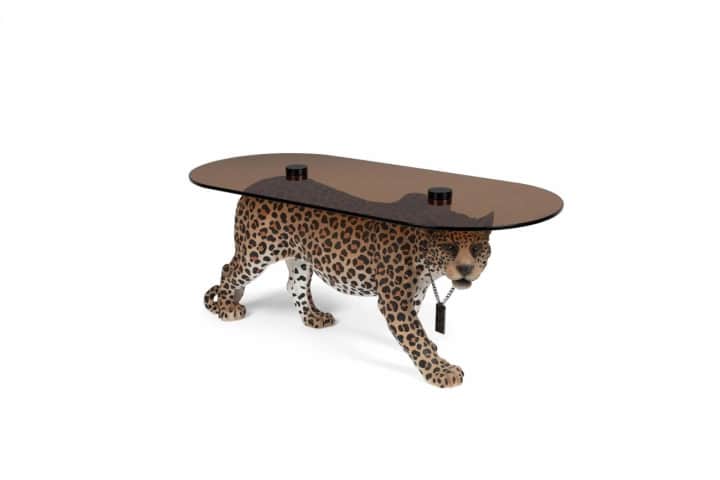 An artistic coffee table designed in the shape of a walking leopard. The leopard's body serves as th… — 3D model