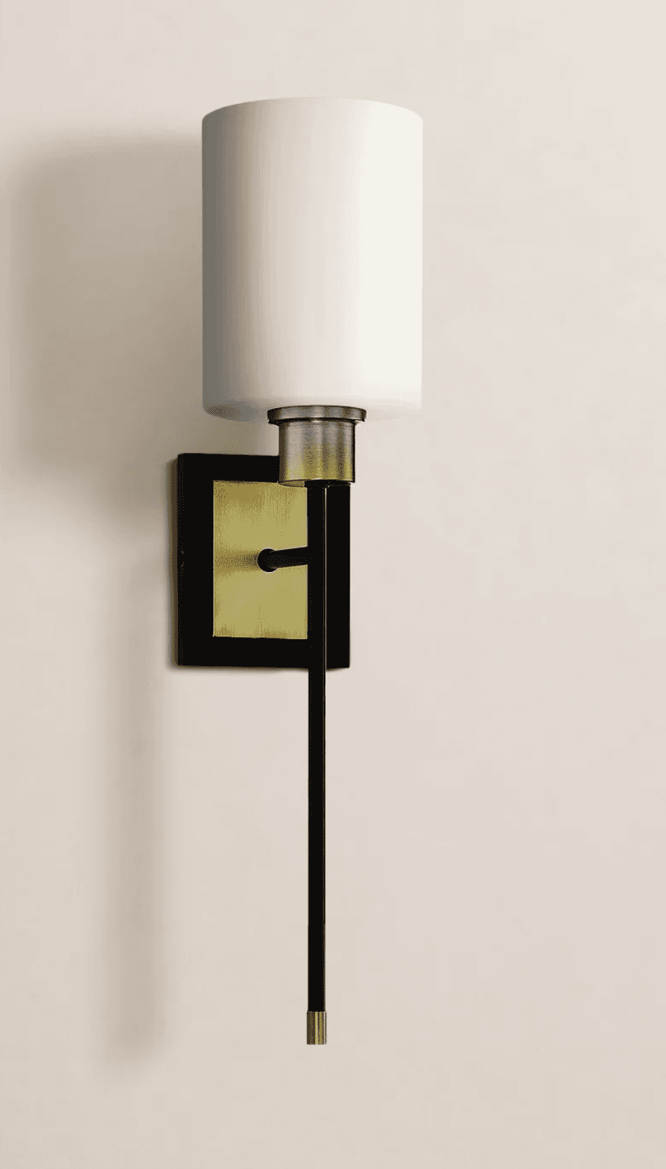 A modern wall lamp with a cylindrical white shade. The lamp features a black metal arm extending dow… — 3D model
