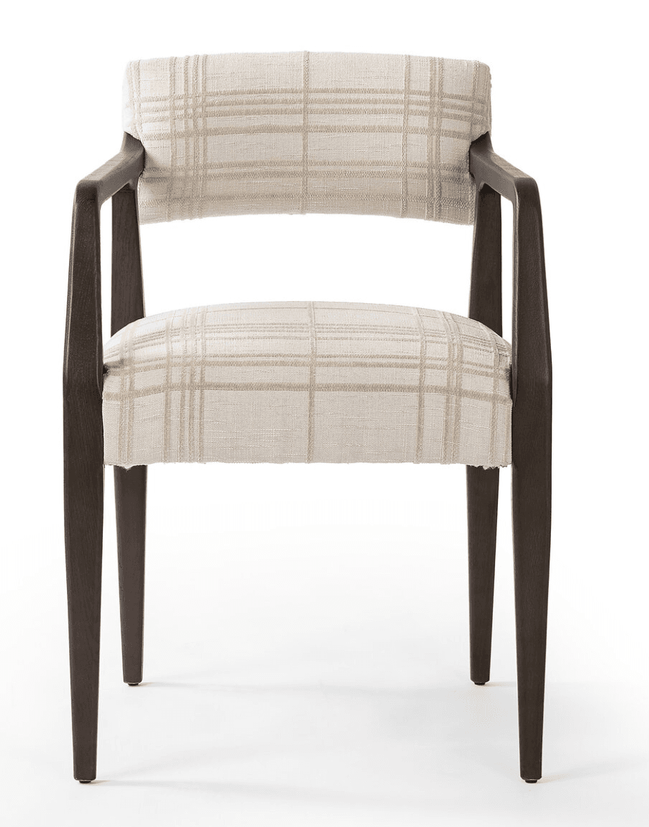 A contemporary upholstered armchair featuring a dark wooden frame and a light plaid fabric. The chair has a separate upholstered backrest and seat, with integrated wooden armrests that flow into the rear legs. The legs are slender and tapered. — 3D model
