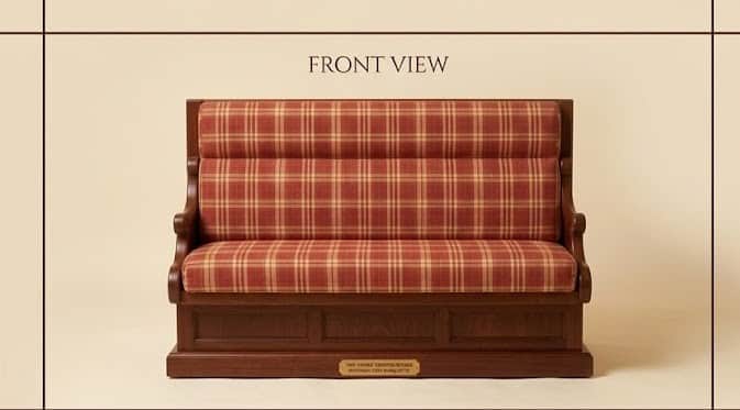 A high-back seating unit featuring a dark wooden frame and a red and beige plaid upholstered seat an… — free OBJ 3D model