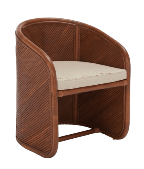A barrel-shaped armchair constructed from rattan, featuring a curved back and armrests. The side panels and back are composed of tightly spaced, angled rattan reeds, creating a visually textured surface. A light-colored upholstered cushion sits on the seat. The frame is a polished, dark brown rattan, with a reinforcing horizontal support beneath the seat. — 3D model