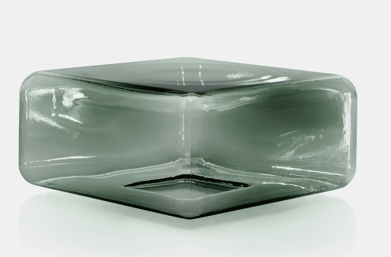 A modern rectangular vase crafted from smoked green glass, featuring softly rounded corners and a thick, substantial construction. The top opening is a narrow slit along the central axis, suggesting a design intended for specific floral arrangements or as a standalone sculptural piece. Its transparent yet tinted material allows for subtle light play. — 3D model