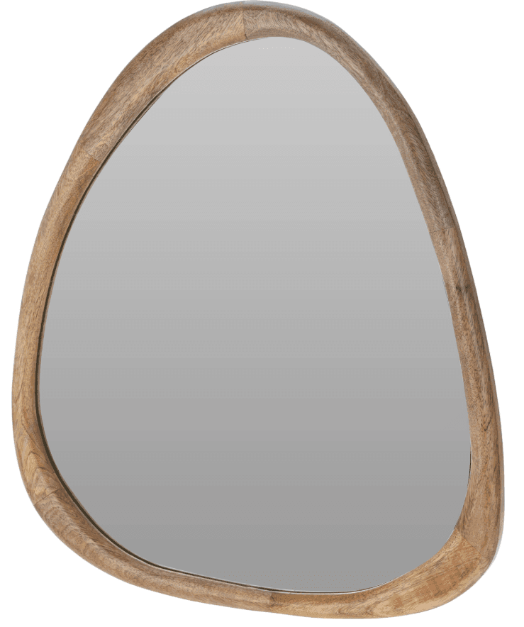 An irregularly shaped mirror with a rounded, organic frame. The reflective surface is centrally located and appears to be made of glass. The frame has a natural wood grain texture. — 3D model